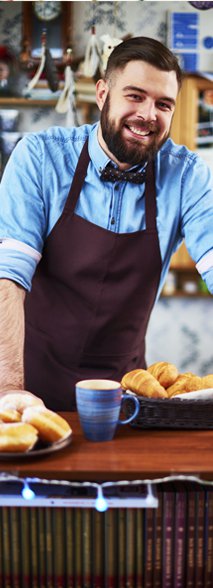 Person working behind bakery counter